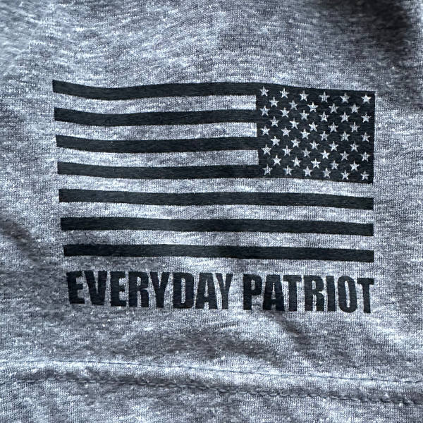 flag with Everyday Patriot under it on the sleeve of the shirt